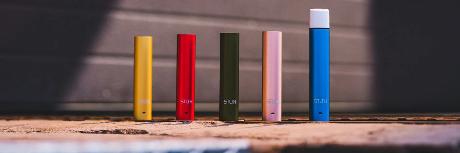Flat lay of different beginner-friendly pod systems and vape pods arranged neatly on a table.
